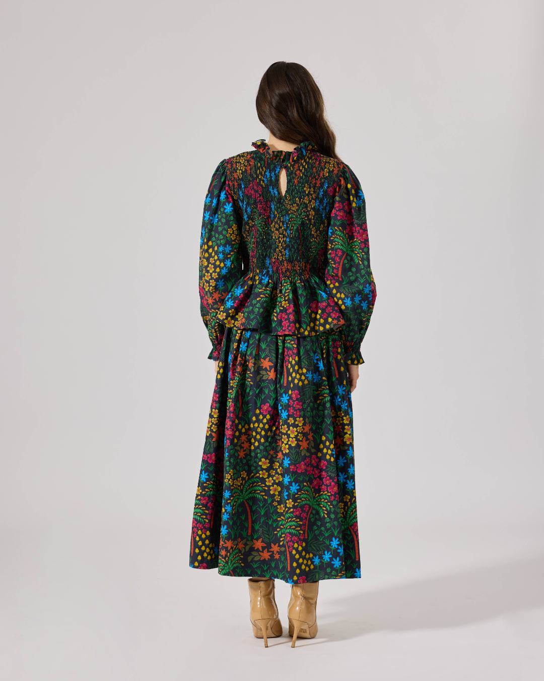 FLEUR SMOCKED PEPLUM TOP FLORIDO BLACK